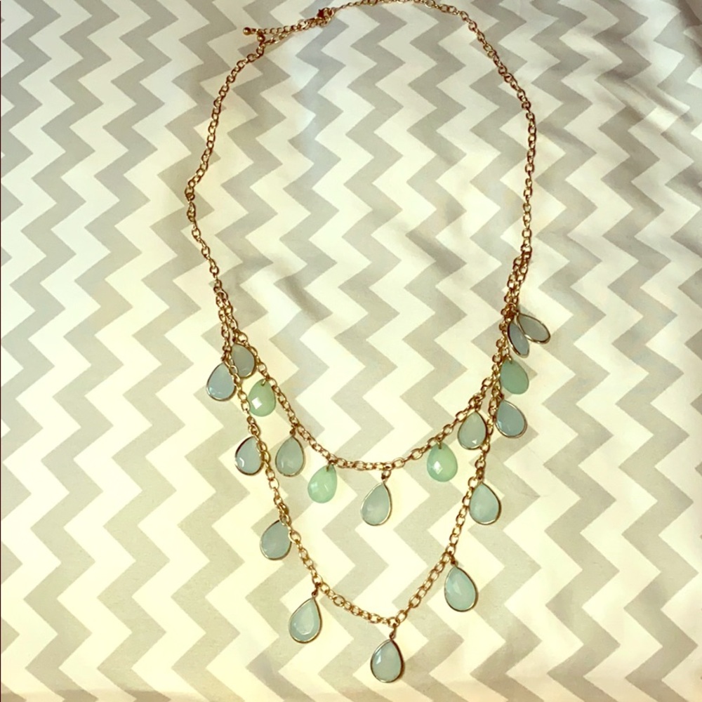Blue green charm necklace on a gold chain